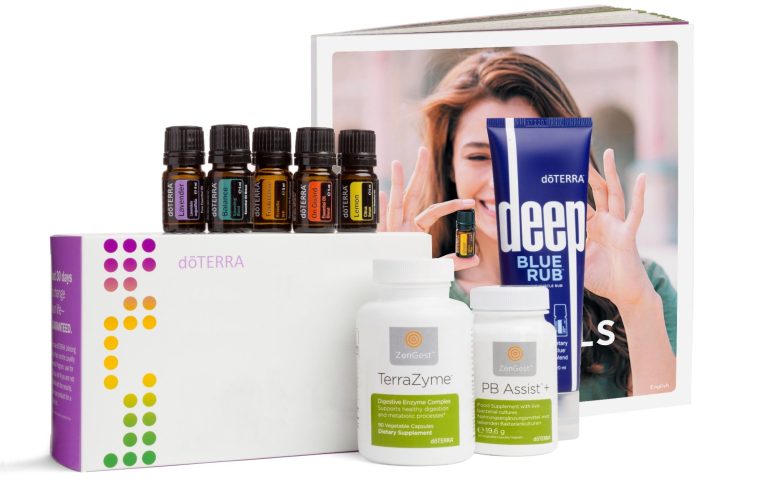 Set mit ätherischen Ölen, Pflegeprodukten und einem Buch über Gesundheit und Wellness.